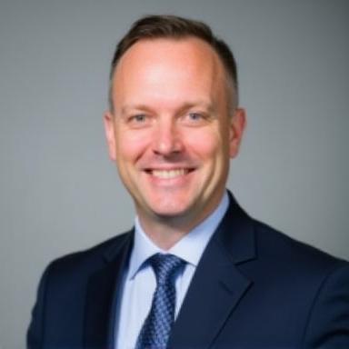 Professional headshot of Ben Carter.